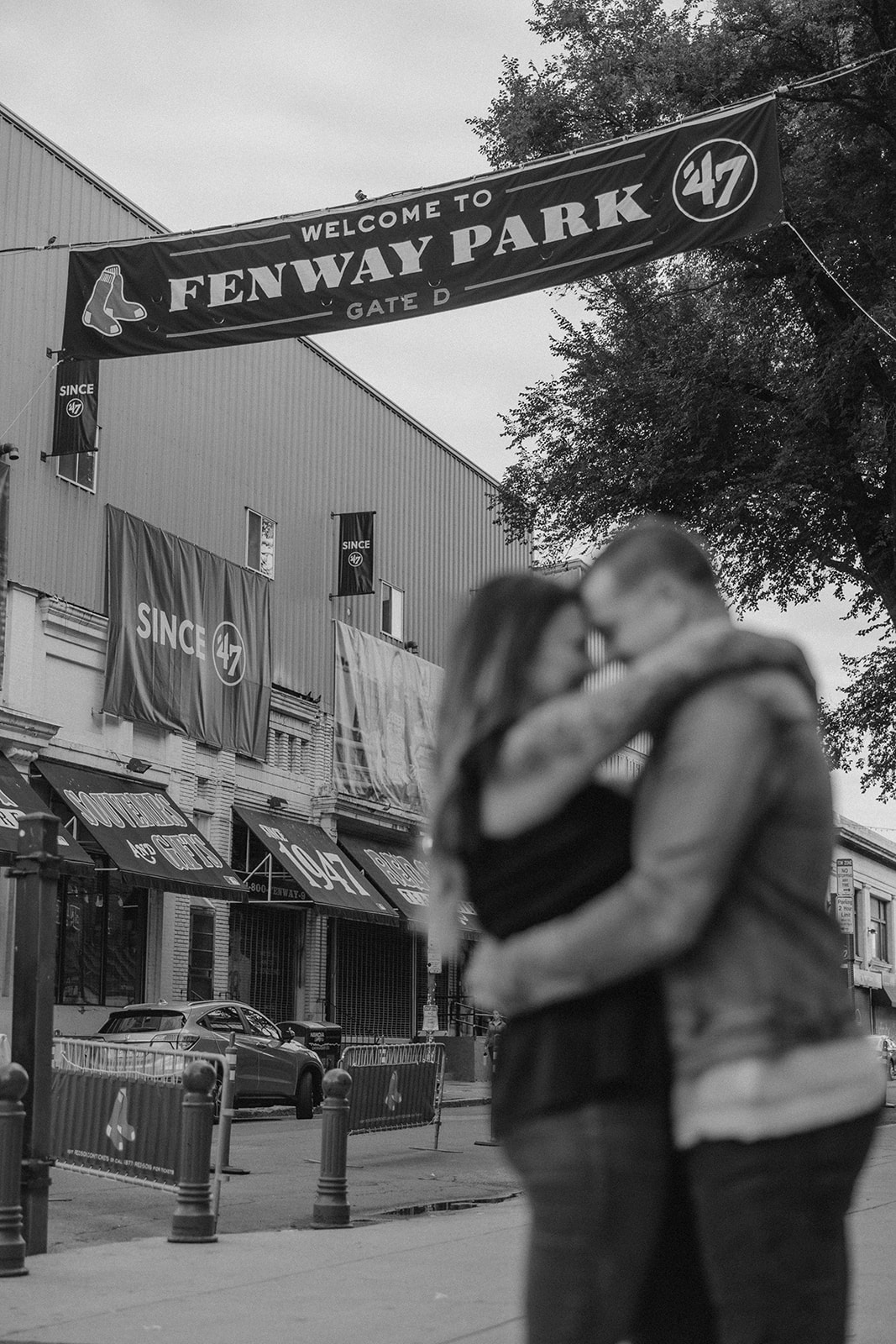 stunning couple pose together during their Boston anniversary photoshoot around Fenway Park