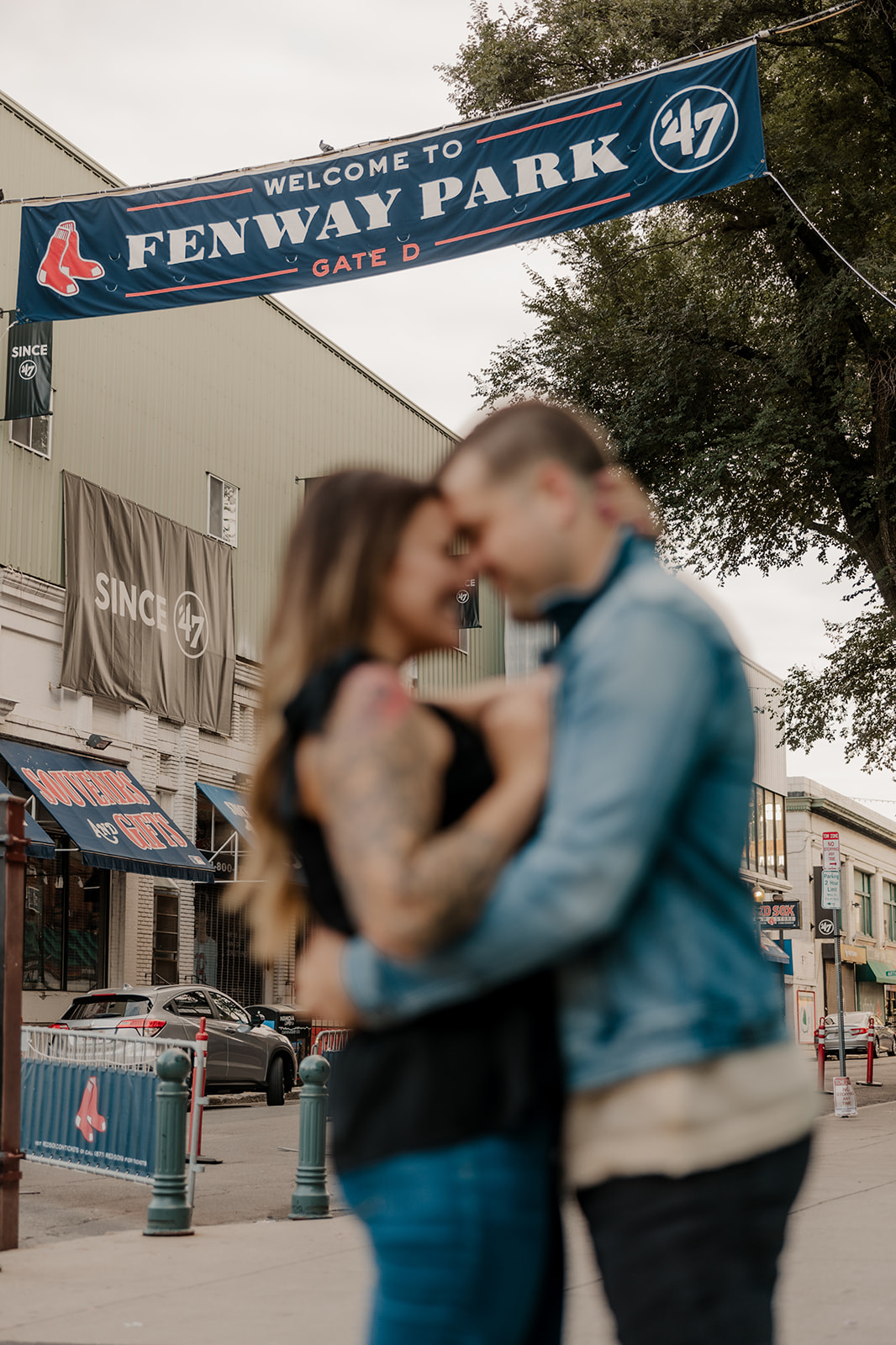 stunning couple pose together during their Boston anniversary photo shoot around Fenway Park