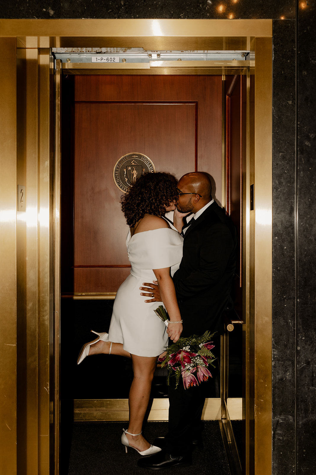 bride and groom share an intimate moment after their state house elopement