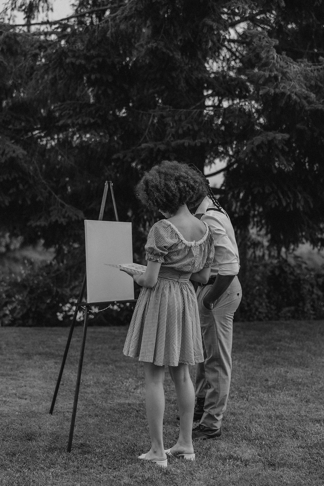 beautiful couple pose together in the backyard