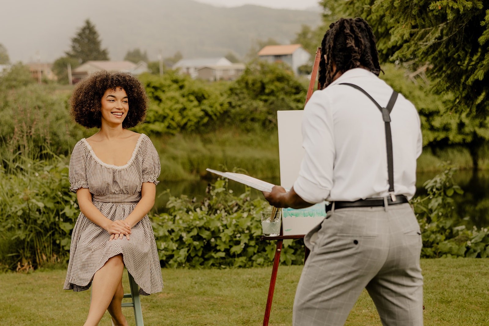 beautiful couple pose together in the backyard