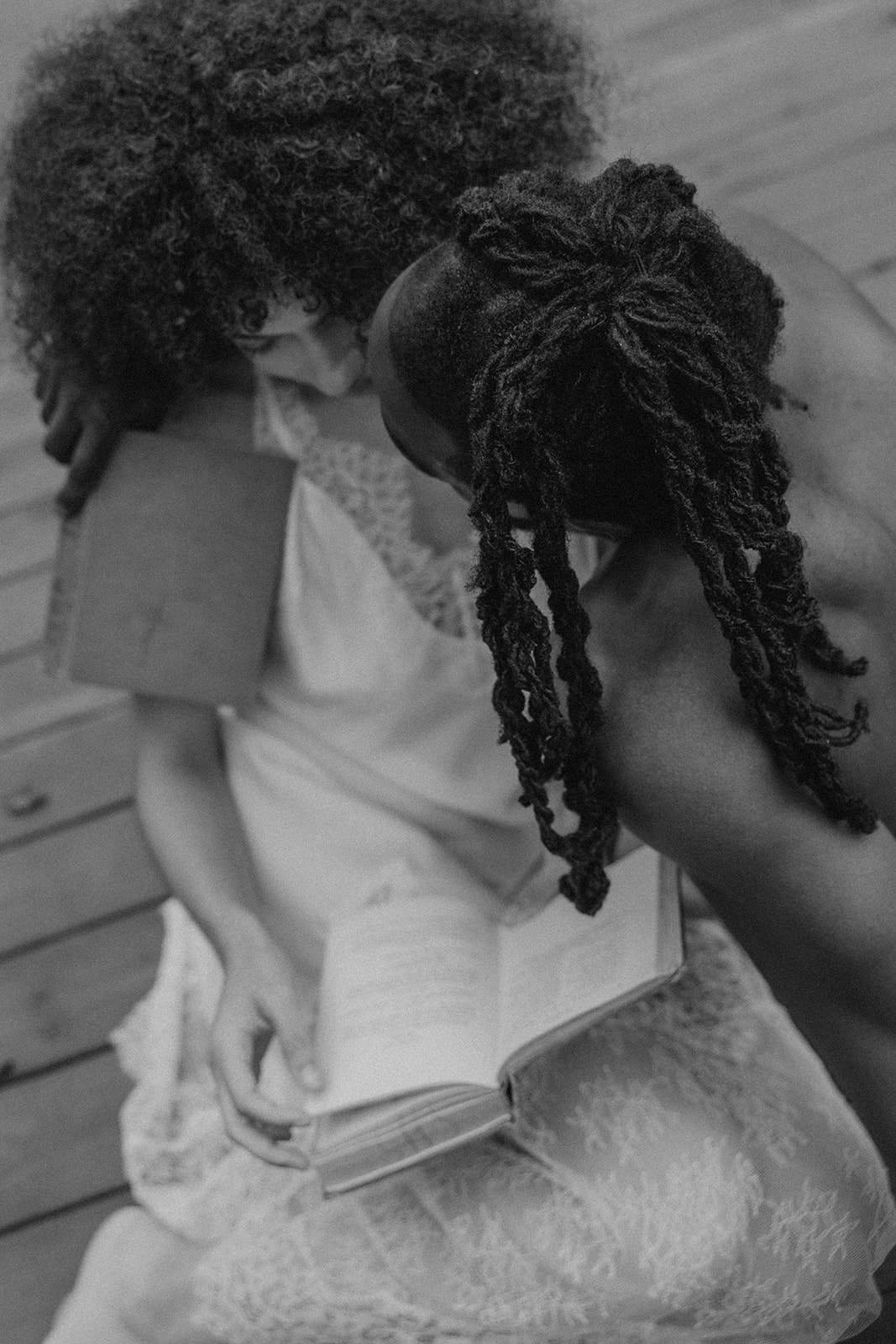 beautiful couple pose together on a dock